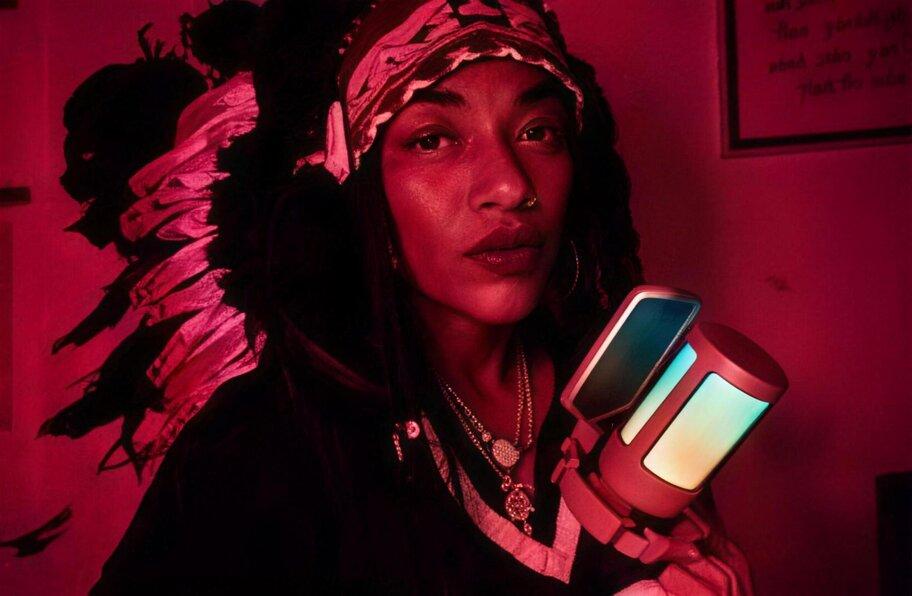 Chief I'ni MichElle.magic live in the red-lit studio, moment 4 of 4
